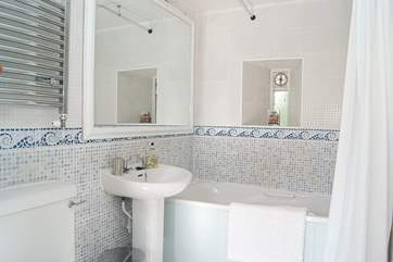 The bathroom with three-quarter size bath.