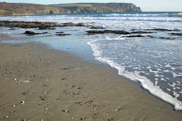 Pendower beach as the tide comes in.