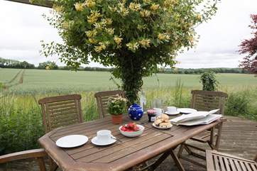 The rear terrace opens out onto fields with wide expansive views.