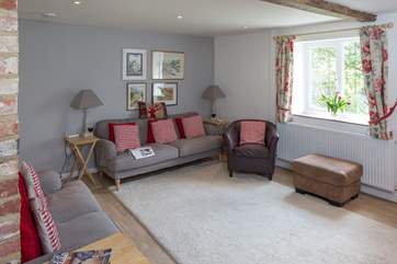 Stairs lead from the sitting-room and a door at the foot of the stairs is for the ground floor bedroom.