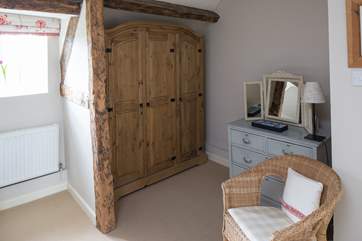 Bedroom 2 has real character; exposed beams create storage and a dressing-area.