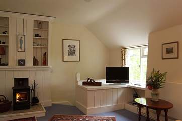 The sitting-room has a wood-burner.