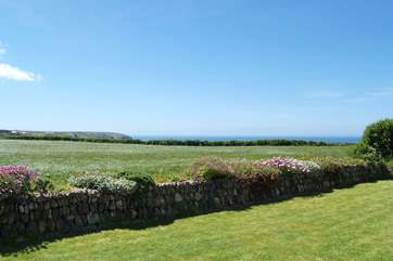 The fabulous view across the fields to the sea from the back garden.