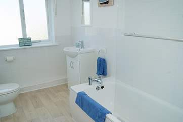 The bathroom is spotlessly white!