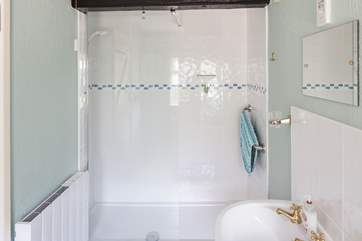 The spacious en suite shower-room has a large walk-in shower.