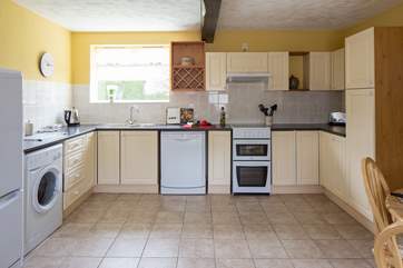 The well-equipped kitchen has all that you could need to create a culinary masterpiece.