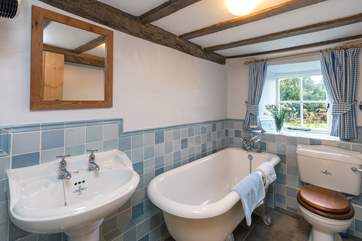The bathroom on the ground floor has a lovely roll-top bath.