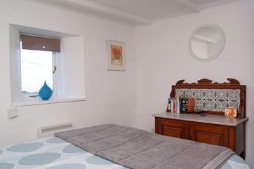 Bedroom 1, the master bedroom has stunning distant sea views.