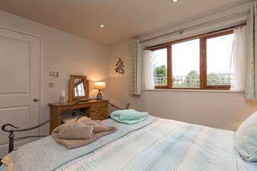 The bedroom windows look out onto your patio.