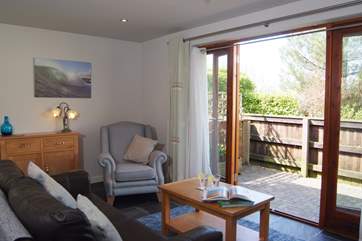 The open plan living, dining, kitchen area opens onto one of the two outside areas that are dedicated to Moonstone.