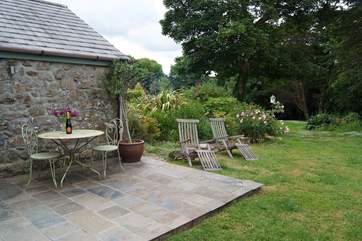 The patio leads onto the large gardens, yours to explore at your leisure.