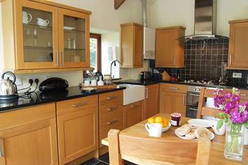 The sylish kitchen/dining-room opens onto the garden so you can eat inside or out depending on the weather.