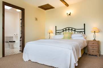 The bedroom in the attached annexe has its own en suite bathroom
