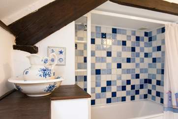 There is a fitted shower over the bath.