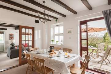 The dining-room links the sitting-room and kitchen, with a door out to the dining terrace.