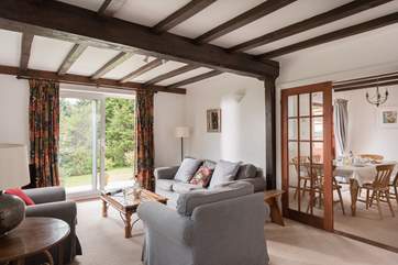 The sitting-room leads through to the dining-room.