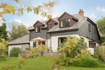Froglands sits amid eight acres of garden, meadow and woodland.