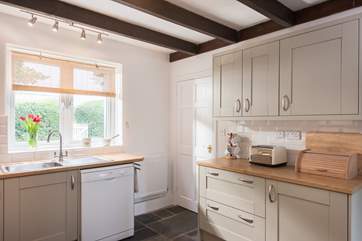 The kitchen looks out over the front garden.