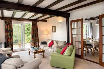 The dining room leads off from the sitting room