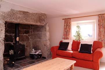 The second sitting-room has a large wood-burner.