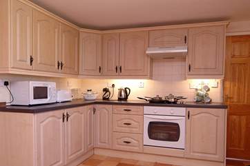 The kitchen (the door leads down a couple of steps to the ground floor shower-room).