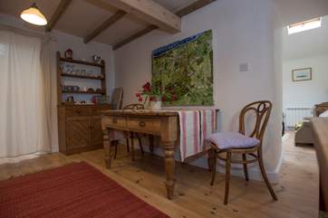 The dining-area with the sitting-room in the background.