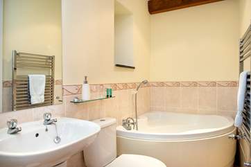 The bathroom is fabulous and has a lovely corner bath.