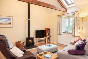 The gorgeous open plan living area is warm and cosy.