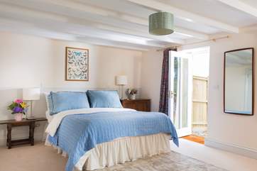 The gorgeous master bedroom with a door onto the garden.