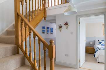 The lower ground hallway with stairs rising to the ground floor.