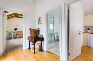 The entrance hall with doors into the living-room, the kitchen and the cloakroom/shower-room all on this level.