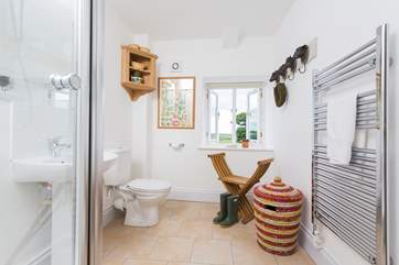 The shower-room also doubles up as a cloakroom with fun animal head hooks.