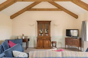 Comfortable sofa and chair for relaxing around the TV or with a good book.