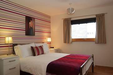 Bedroom 1 has a king size bed and an en suite shower-room.