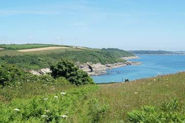 Looking towards Falmouth and the Roseland peninsula in the distance from the coastal footpath near Opie's Toy.
