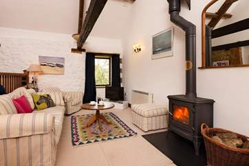 The accommodation is reverse-level and open plan so that you can make the most of the views. The wood-burner makes this a great base all year round.