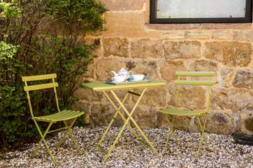 Enjoy an early morning coffee at this little bistro-table.