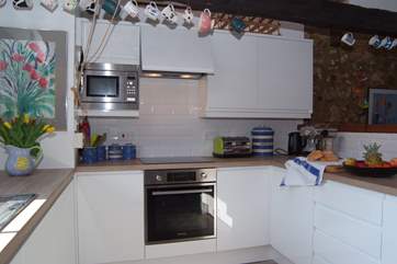 The new kitchen design complements the traditional features of this lovely barn conversion.