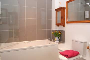 This is the brand new bathroom for 2018, with its fitted shower and stylish contemporary tiles.