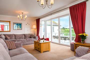 From the lounge the patio doors lead out to the large terrace area...