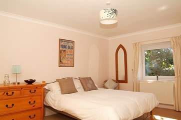 Spacious Bedroom 2 is furnished with a king-size bed.