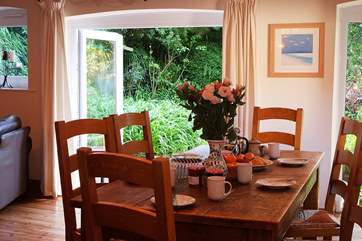 Breakfast is served with views over the garden.