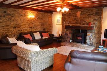 The sitting/dining-room is spacious and a perfect place to relax after a day out on the beach or walking the coastal paths.