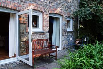 The front patio is a lovely place to sit at any time of day, fire up the chimenea if it gets a little chilly.