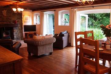 The sitting/dining-room is a lovely large room with room to relax, play board games or dine with friends and family.