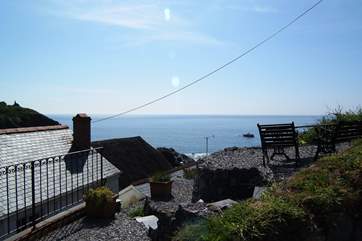 The steep terraced garden has spectacular views across the village and the cove and is accessed via steep stone steps to the rear of the cottage.