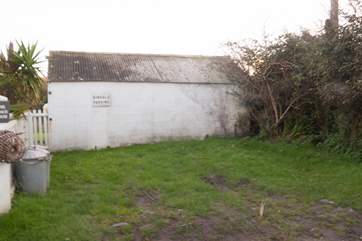 The parking area is located 450 yards up the steep hill beside the cottage on the left side of the lane as it starts to level, room for two cars.
