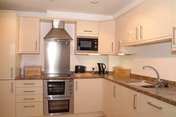 The kitchen is very well-equipped and has sea views too.