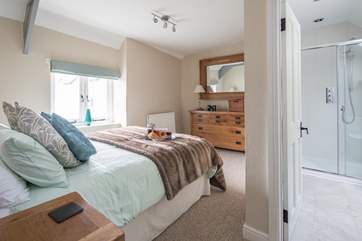 The master bedroom has a spacious en-suite shower-room.