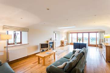 The sitting-area has doors leading out to the rear terrace.